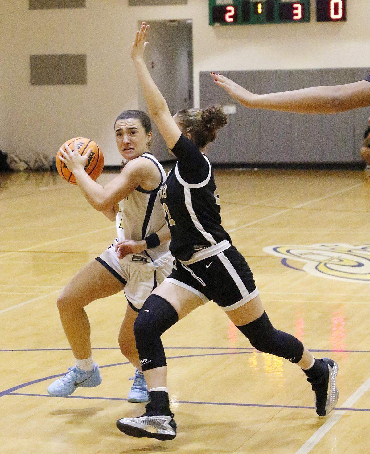 Carrollton Sela Travieso (2) plays against La Salle during Region 4-3A girls’ basketball final game on Friday, February 27, 2026 at Carrollton School in Coconut Grove. Andrew Uloza / for Miami Herald