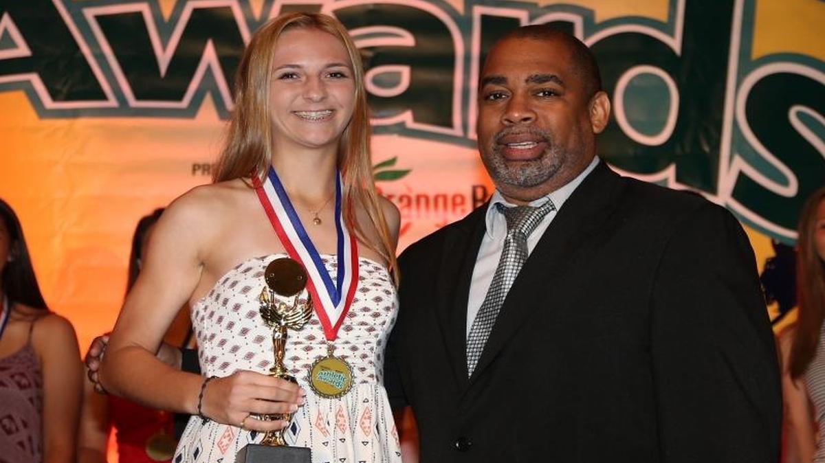 American Heritage's Zandy Soree, left, stands with Miami Herald assistant sports editor John Devine after being named 2015-2016 3A-1A Girls' Soccer Player of the Year. The Miami Herald's All-Broward athletic awards banquet was held on Tues., May 24, 2016 inside the Signature Grand Ballroom in Fort Lauderdale, Florida.