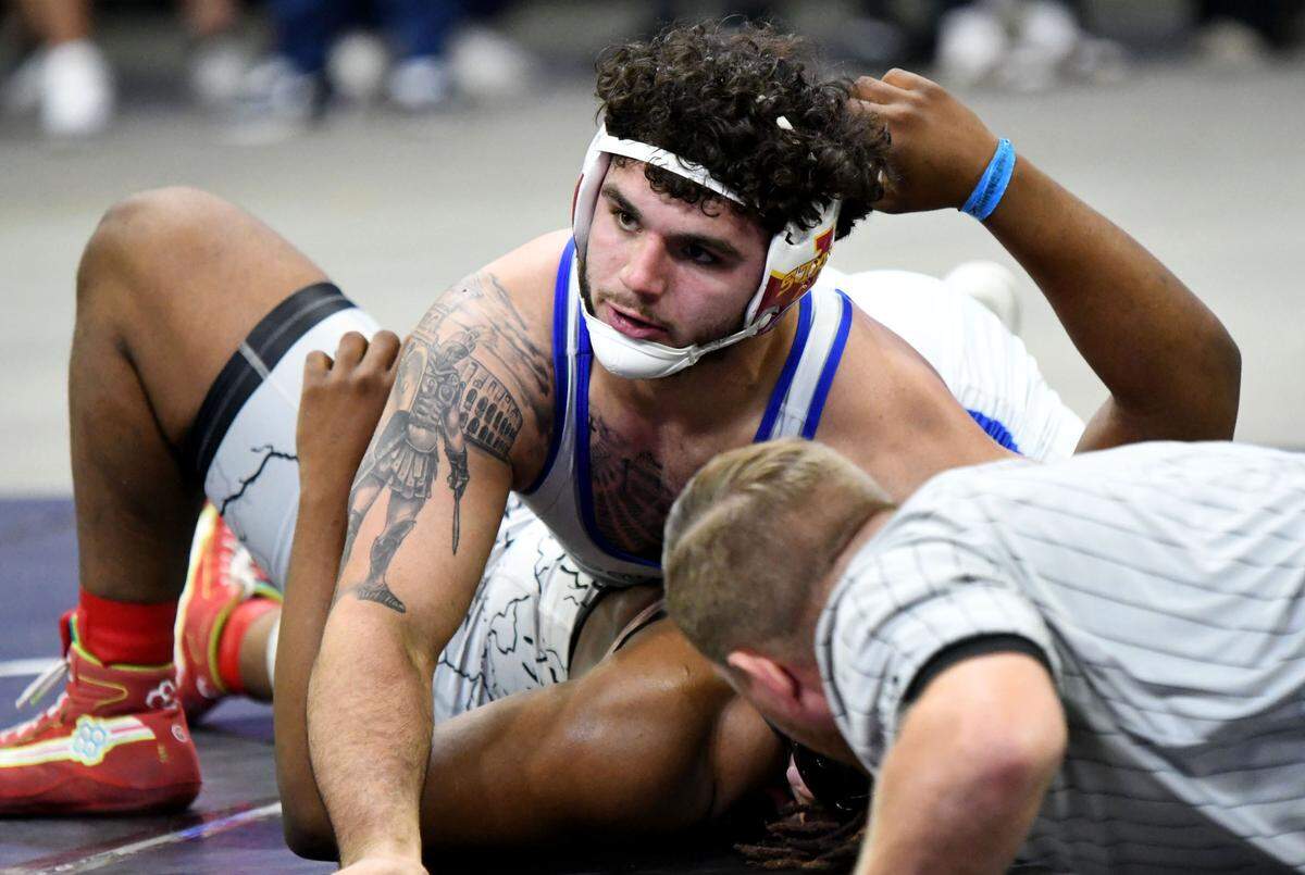 South Dade senior Sawyer Bartelt pins Nathan Adras, from Dr. Krop, in the 215-pound state championship match on Saturday at Silver Spurs Arena in Kissimmee.