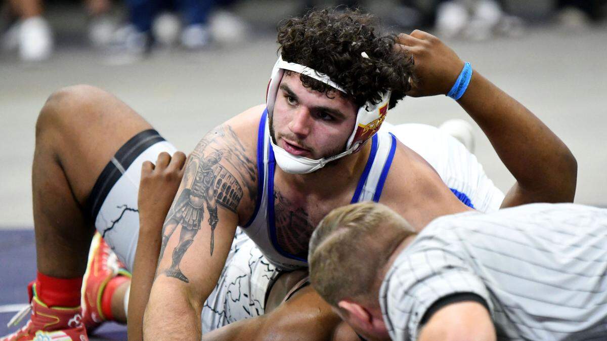 South Dade senior Sawyer Bartelt pins Nathan Adras, from Dr. Krop, in the 215-pound state championship match on Saturday at Silver Spurs Arena in Kissimmee.