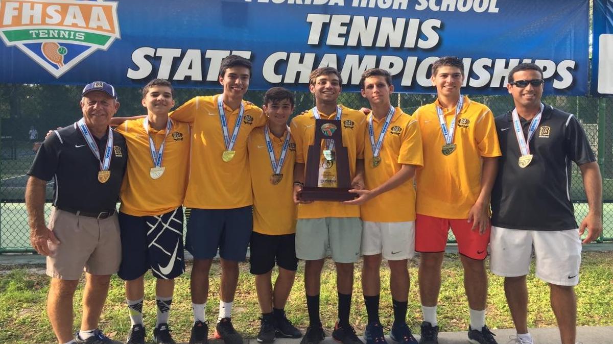 Staff and players from Belen Jesuit’s state championship tennis team show off their trophy, from left: athletic director Carlos Barquin, Sebastian Duenas, Lucas Venegas, Juan Rodriguez, Daniel Martinez, Eduardo Scheuren, Carlos Grande and coach JD Barbosa.