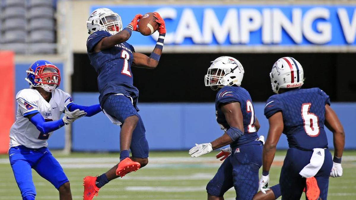 Chaminade Madonna cornerback Te’Cory Couch, seen here intercepting a ball in the Class 3A State Championship, was one of eight Chaminade players named to the Class 3A All-State team.