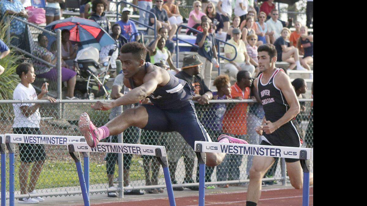 
Westminster Academy’s Sanders Desir wins the 110 hurdles during the Region 4-1A Track and Field Championships on Friday, April 24, 2015 at Westminster Academy Athletic Complex in Lauderdale Lakes.
