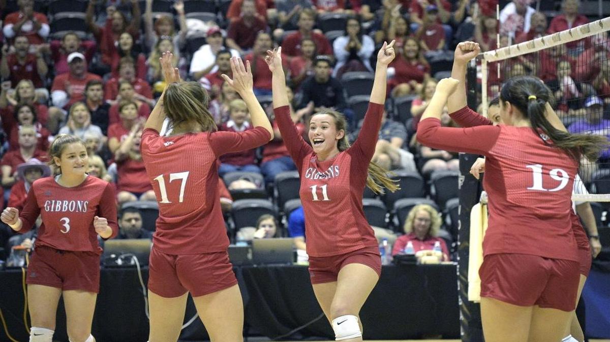 Cardinal Gibbons' Gabby Cook (3), Sarah Martin (17), Natalie Novak (11) and Nikki Restrepo (19) celebrate after a score during a high school FHSAA Class 4A State Volleyball Finals Championship game against Trinity Catholic in Orlando, Fla., Saturday, Nov. 14, 2015.