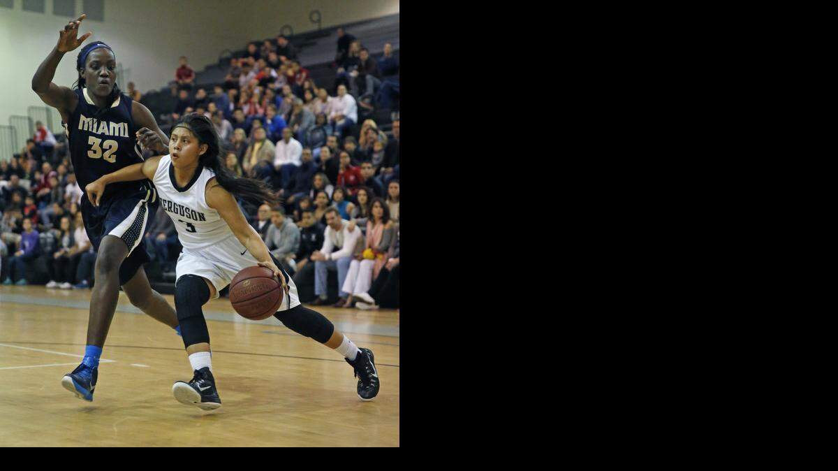 
Ferguson's Annie Osceola drives as Miami High's Beatrice Mompremier defends as Ferguson High hosts Miami High in girls' basketball at Ferguson High on Saturday, February 14, 2015.
