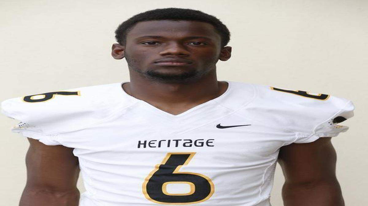 
American Heritage’s Torrance Gibson kept his commitment and signed with Ohio State during National Signing Day on Feb. 4, 2015.
