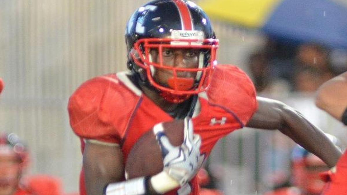 
Miramar running back Gregori McCrae looks for yards during the first half against visiting South Plantation on Friday, Sept. 25, 2015.
