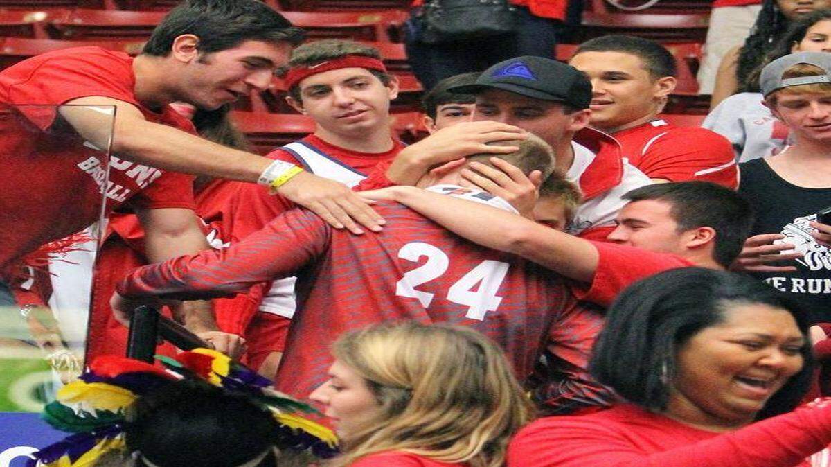 
Cardinal Gibbons' Maverick Rowan works his way through the stands after beating Rickards during the FHSAA Boys 5A Basketball championship Saturday February 28, 2015 in Lakeland. Gibbons won the state title 74-58.
