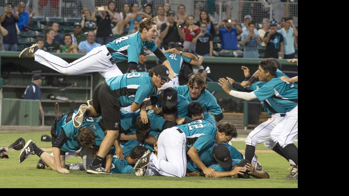 
the party is on: Archbishop McCarthy players celebrate after winning the Class 5A state title on Saturday night by beating Lynn Haven Mosley.

