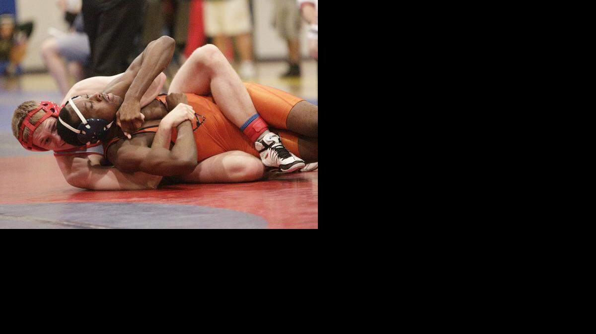 
Cardinal Gibbons’ Alex Lopouchanski wrestles Stranahan's Dilano Taylor during the BCAA wrestling Championships on Saturday, February 7, 2015 at Pompano Beach High School.
