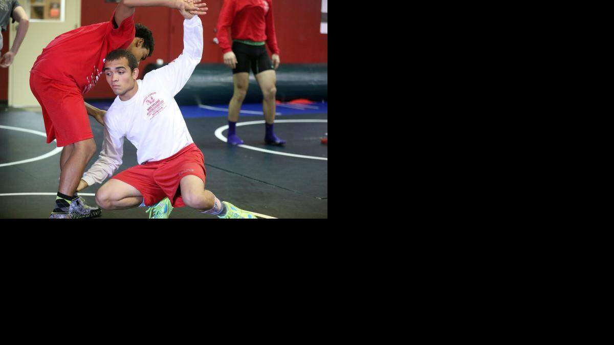 
Cardinal Gibbons’ Dominick Gibson, right, was 25-1 when he broke his ankle in the BCAA finals and missed out on qualifying for states.
