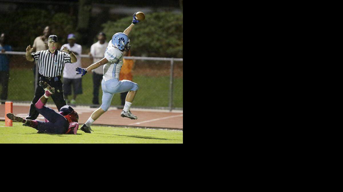 
Coral Springs Charter Panthers Zach Weber (6) scores a touchdown during the football game against the Westminster Academy Lions on Thursday, Oct. 30, 2014, at Westminster Academy Athletic Complex in Lauderdale Lakes.

