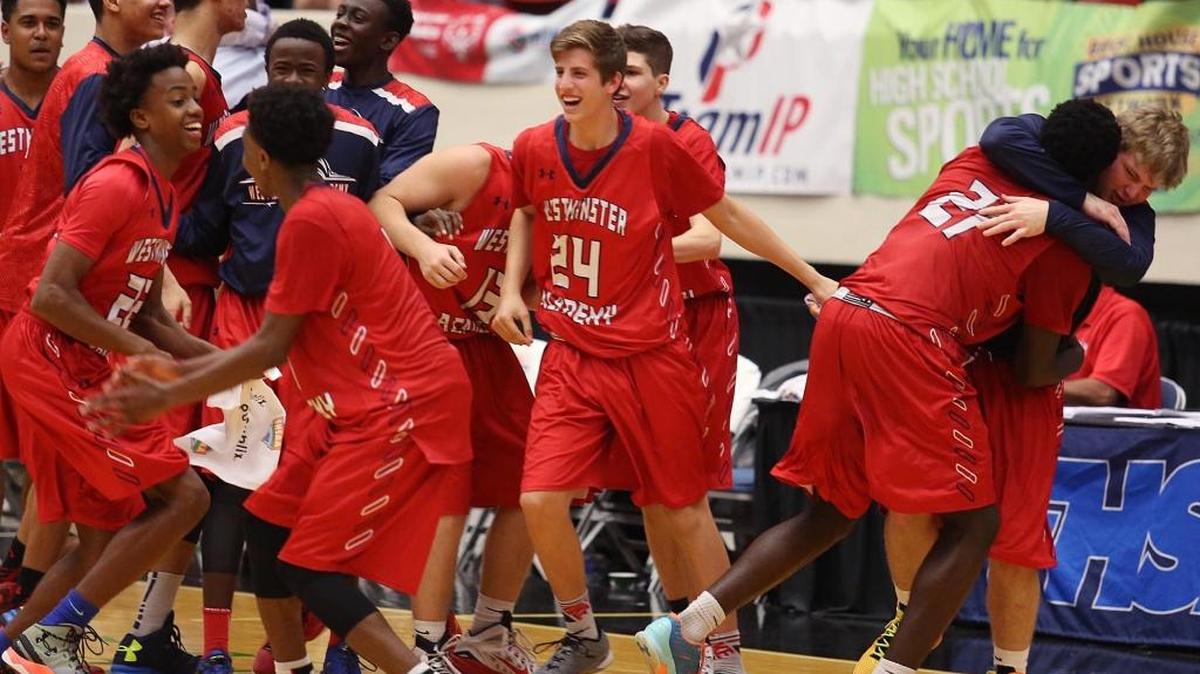 Westminster Academy players celebrate after winning a Class 3A state semifinal game 68-58 against Orlando First Academy at The Lakeland Center on Tuesday, February 23, 2016.
