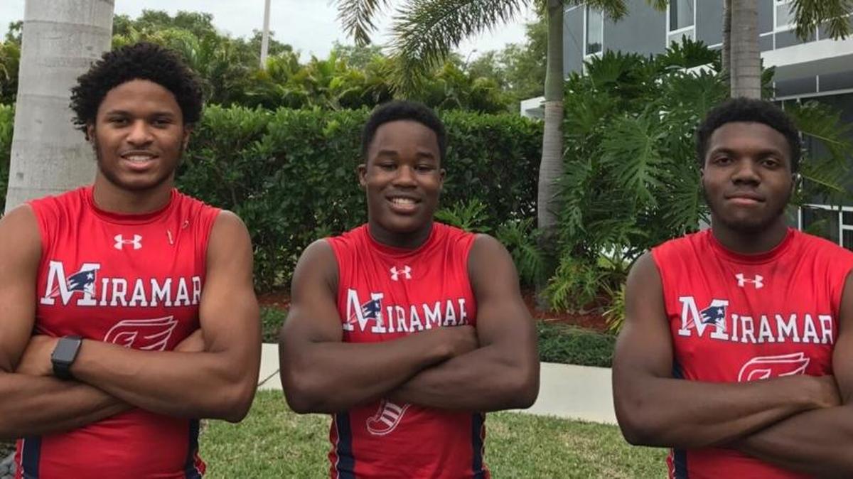 Miramar sprinters (from left to right) Jamal Walton, Taylor Banks and Terrence Horne, Jr. pose for a photo on the eve of the state track and field championships in Bradenton.