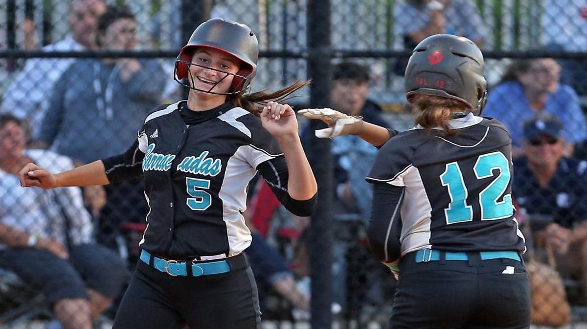 Coral Reef’s Gigi Stouffer score during a regional playoff game against Lourdes on Wednesday.