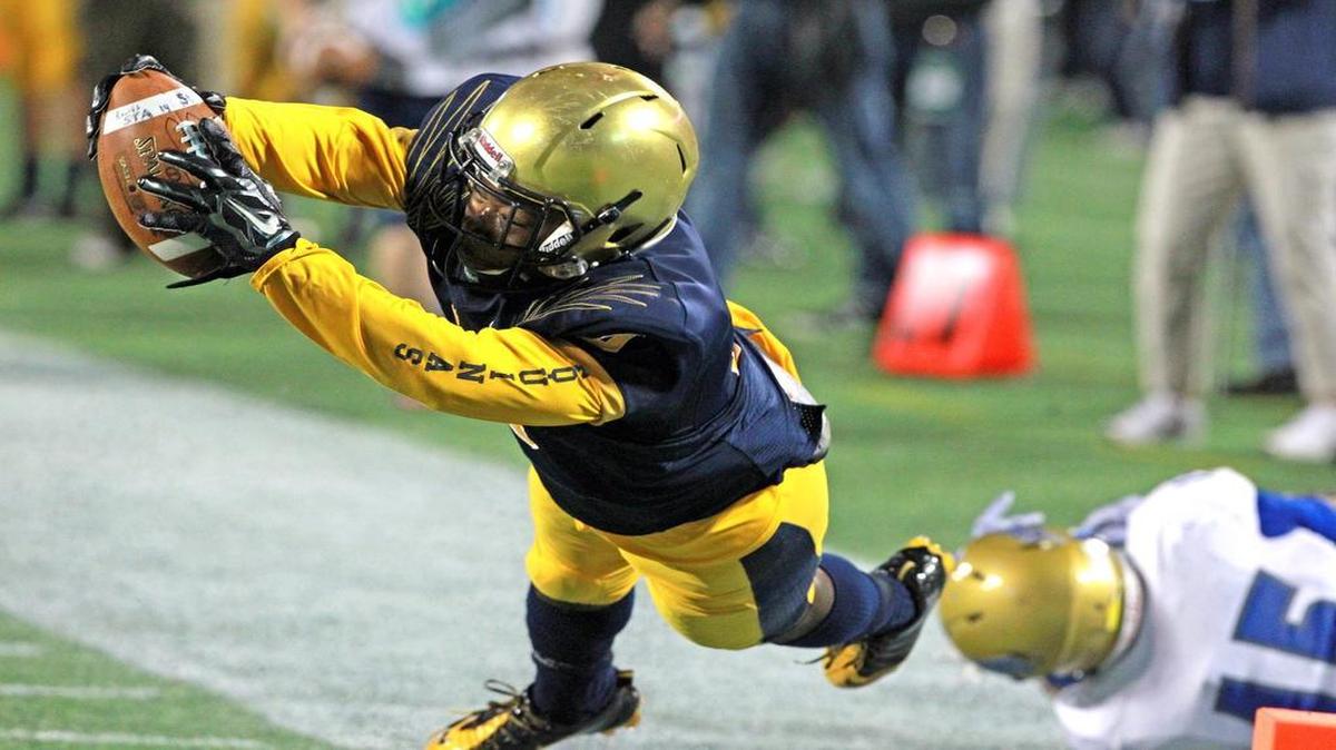 
St. Thomas Aquinas receiver Samuel Bruce dives toward the end zone to help set up a touchdown en route to a victory in the Class 7A title game against Osceola last year. The team’s roster is bursting with talent again as it tries to repeat as state champion and win a third national title.
