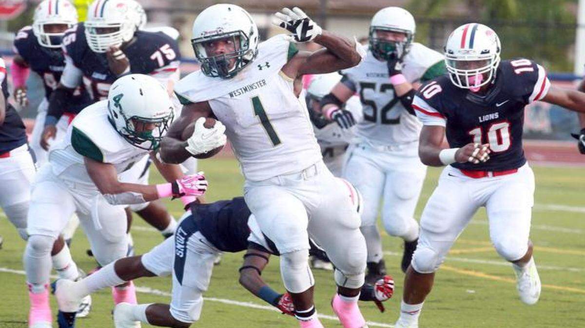 
Jordan Cronkrite, #1 of Westminster Christian, runs for yards in their game against Chaminade-Madonna Prep, in Hollywood, Friday, Oct. 3, 2014.
