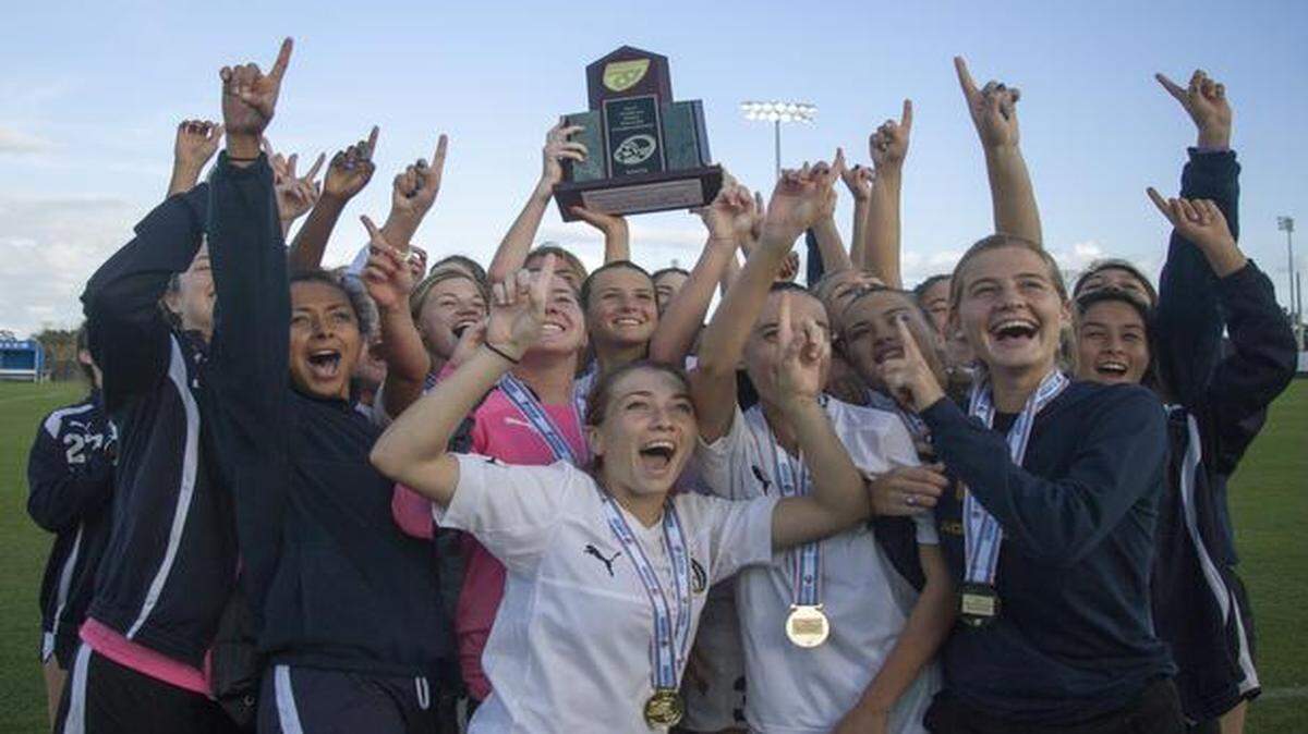 
St. Thomas Aquinas players celebrate after beating Oviedo to win the Class 5A girls’ soccer state championship. It was the program’s 14th state title, second in a row and fourth in five years.
