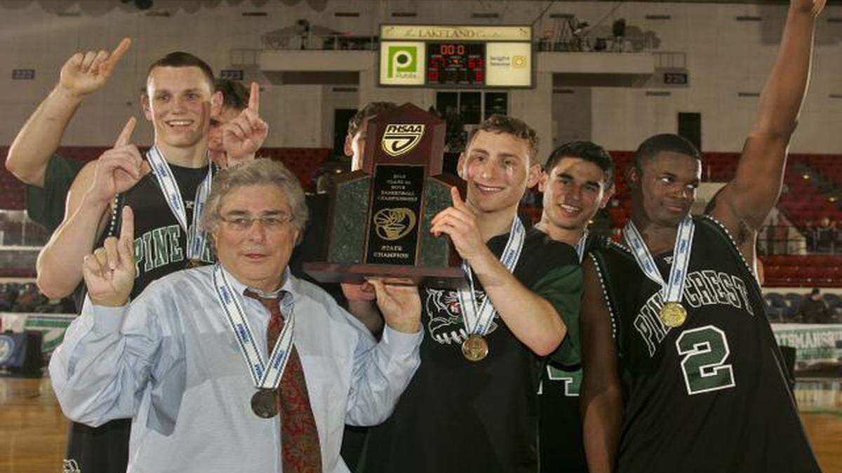 
Pine Crest head coach David Beckerman and senior players pose with the trophy after their FHSAA Class 4A Boys Basketball Championship against Lake Highland Prep Thursday, March 1, 2012 in Lakeland, Fla. 
