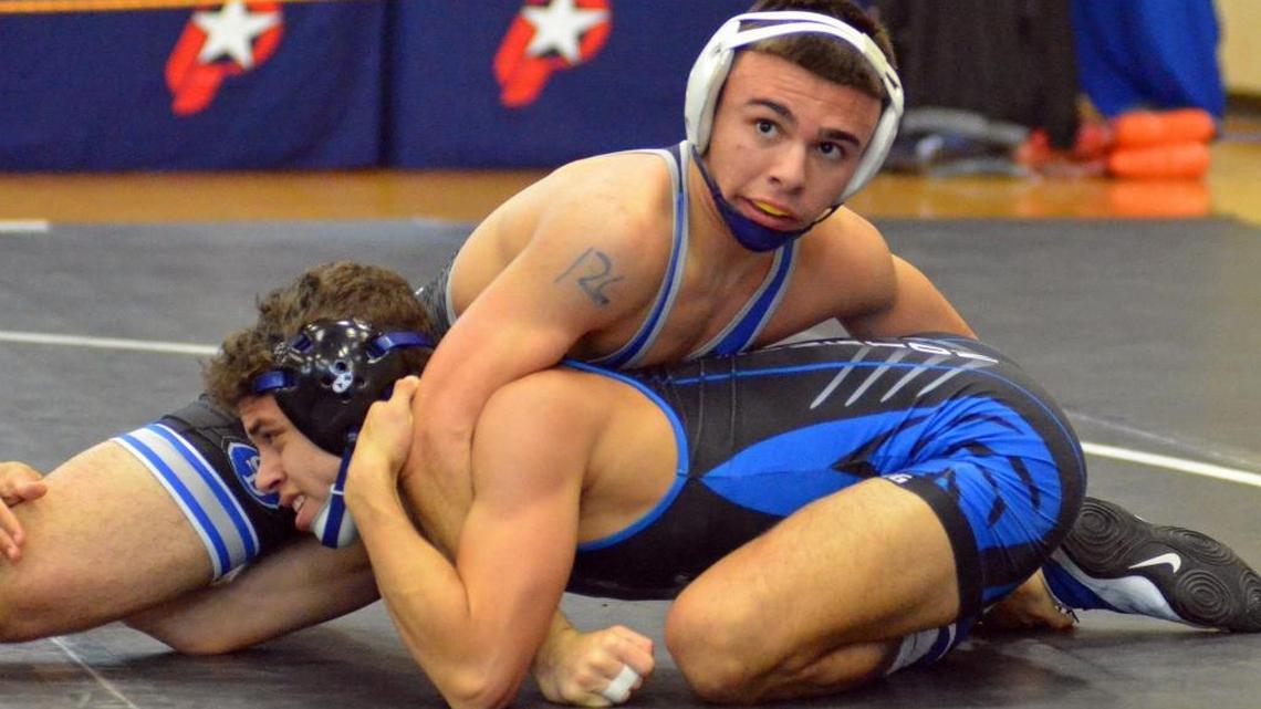 South Dade’s Tyler Orta works his way to a 16-4 major decision win over Wellington Community’s Robert Saldarriaga during a 126-pound, Class 3A semifinals match on Saturday at the FHSAA Duals Wrestling State Championships at Kissimmee Osceola High School.