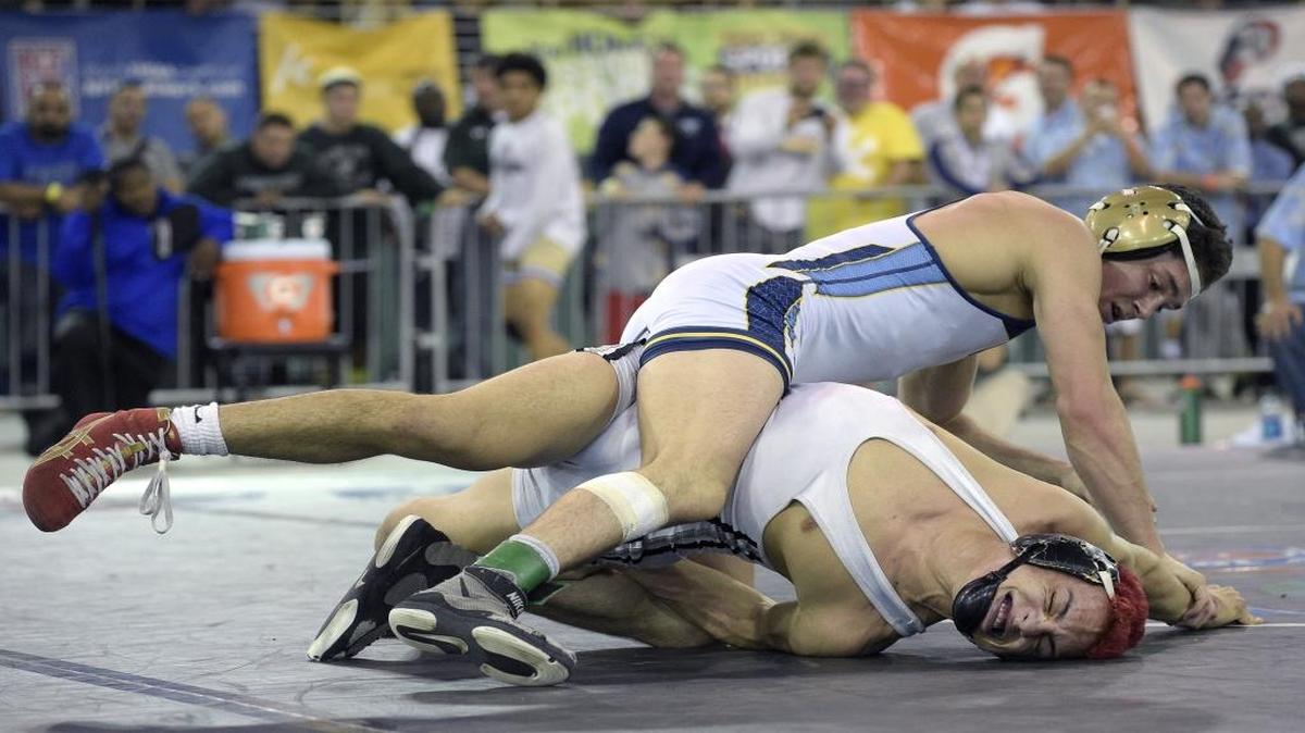 St. Thomas Aquinas' Grant Aronoff, above, defeats Gateway's Justin Comacho during the finals of the Class 3A FHSAA State Wrestling Championships in Kissimmee, Fla., Saturday, March 5, 2016.