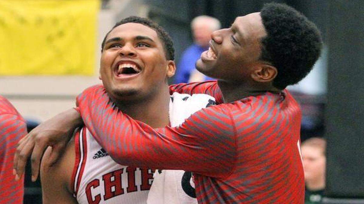 
Cardinal Gibbons’ Richard McIntosh and Melvin Brooks celebrate after beating Rickards to take the Class 5A state title Saturday, Feb. 28, 2015 in Lakeland, Fla. 

