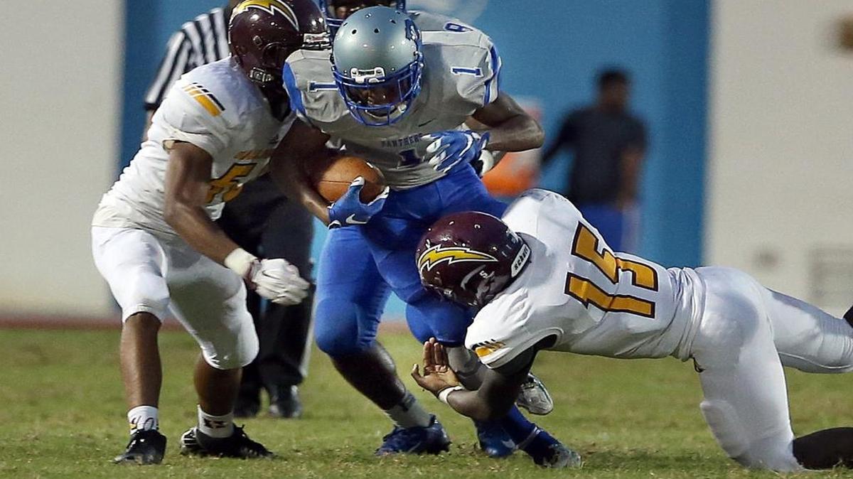 Dillard running back George Golden is shown getting tackled during a game against Hallandale on Sept. 3, 2016. On Nov. 5, 2016, Golden ran for a 40-yard touchdown and a 7-0 lead in the Soul Bowl, but Blanche Ely came back to win in overtime.