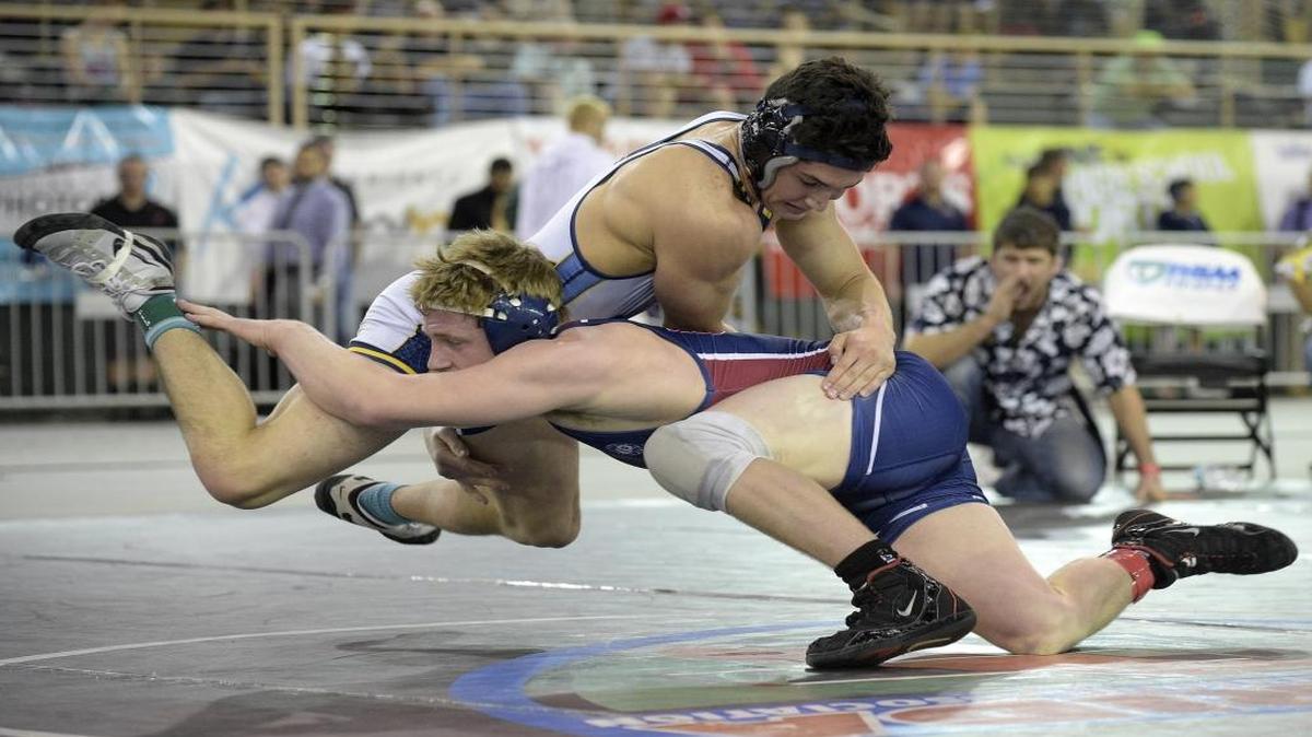 Grant Aranoff, above, of St. Thomas Aquinas, wrestles Connor Prince, of Palm Harbor University, during the finals of the FHSAA State Wrestling Championships in Kissimmee, Fla., Tues., March 14, 2015.
