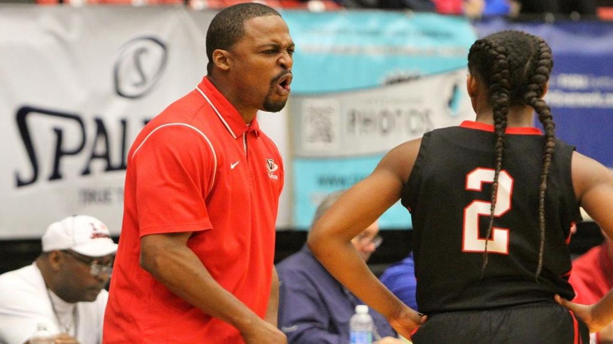 Northeast head coach Zach Gillion talks to player Cabria Lee during the Hurricanes’ 43-37 victory over Orlando Edgewater in a girls’ Class 6A semifinal Friday, February 19, 2016 in Lakeland, Florida.
