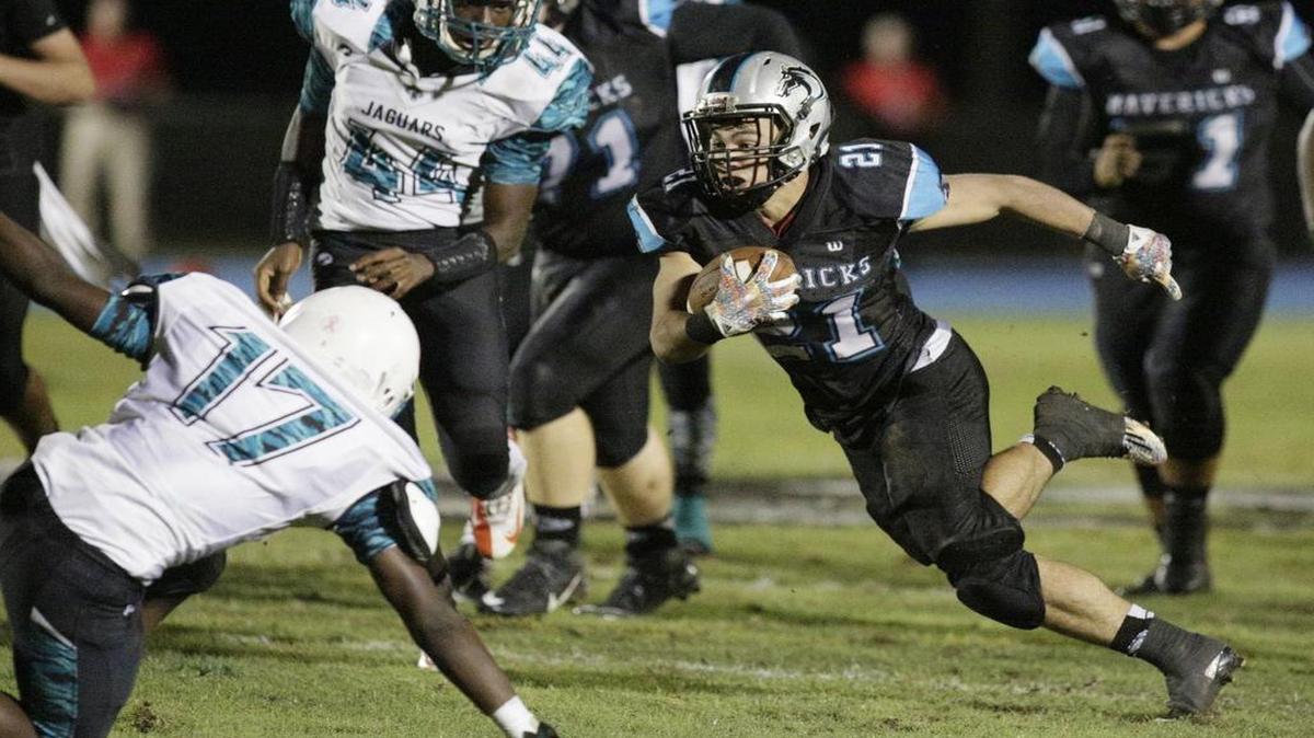 Anthony Rey runs during a 148-yard game with two touchdowns. The senior, who leads Broward with 1,577 yards and 26 touchdowns, withstood lean times at McCarthy to get here.