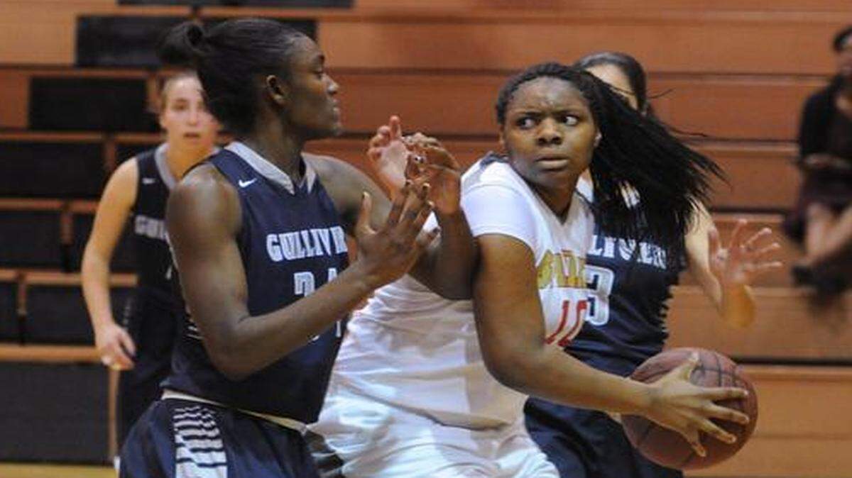 In Miami Gardens:  Gulliver’s Mikayla Thomas, left, tries to stop Pace High’s Kevona Gay on Thursday.