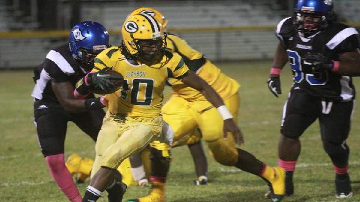 
Desmond Philips, #10 of Jackson High, runs for yards in their game against South Dade High, Friday, Oct. 10, 2014, at Harris Field in Homestead.
