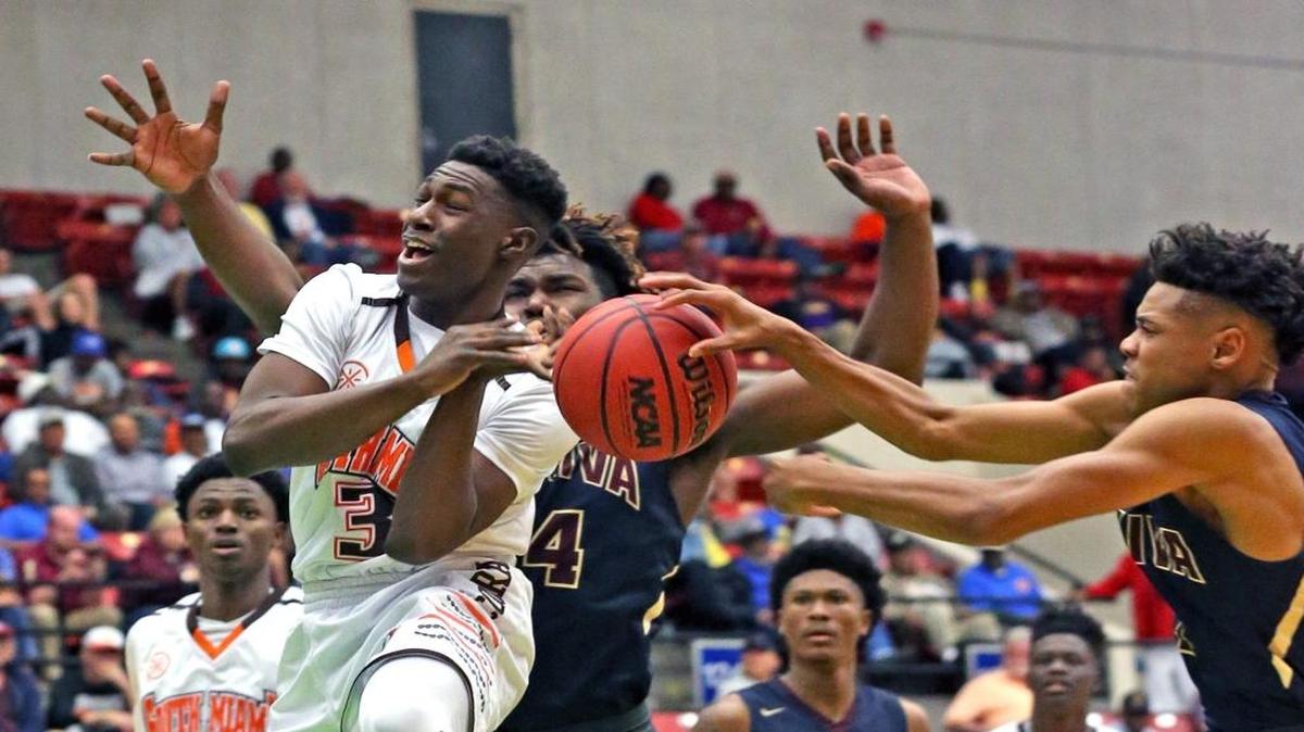 South Miami’s Kaevon Tyler (3) gets the ball stripped by Apopka Wekiva’s Ruben Sheppard (12) in the FHSAA Class 9A semifinals in Lakeland on March 3, 2017.