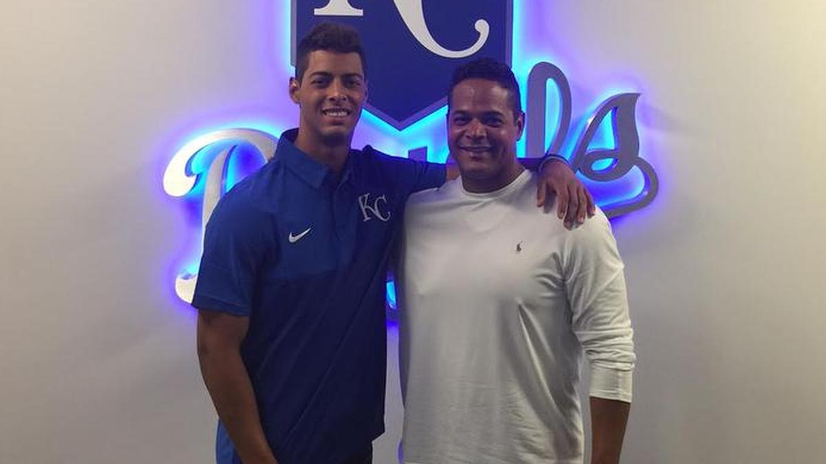 MJ Melendez, left, stands with his father, FIU baseball coach Mervyl Melendez.