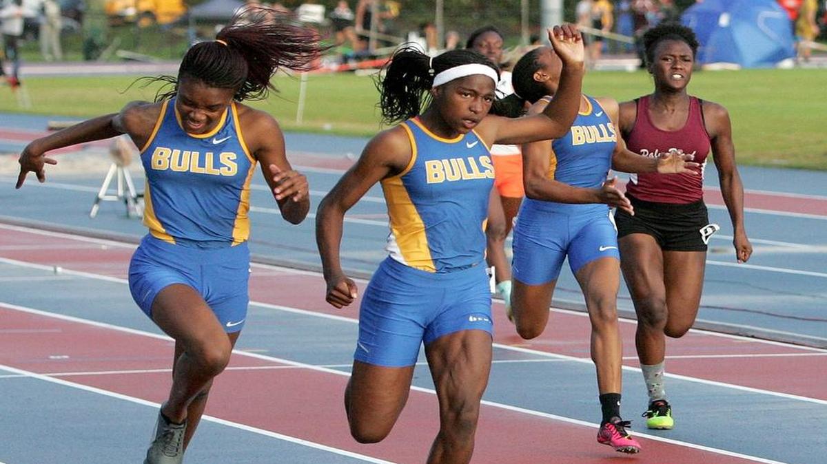 Northwestern’s Twanisha Terry, center, is the defending state champion in the 100- and 200-meter sprints.