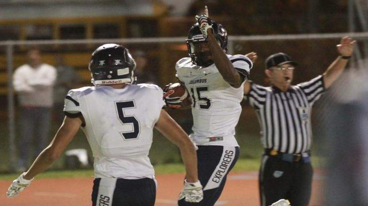 
Jerron Rollins (15) of Columbus High catches a pass for a touchdown in their game against Killian High in the regional football game at Southridge High in South Dade, Friday, Nov. 28, 2014.
