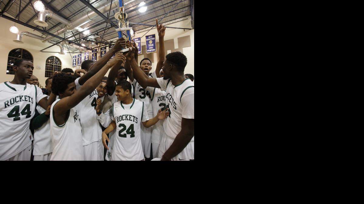 
The Miami Central basketball team celebrates its win in the GMAC boys’ basketball finals against Miami Beach High on Thursday, Jan. 29, 2015, at Miami High gymnasium.
