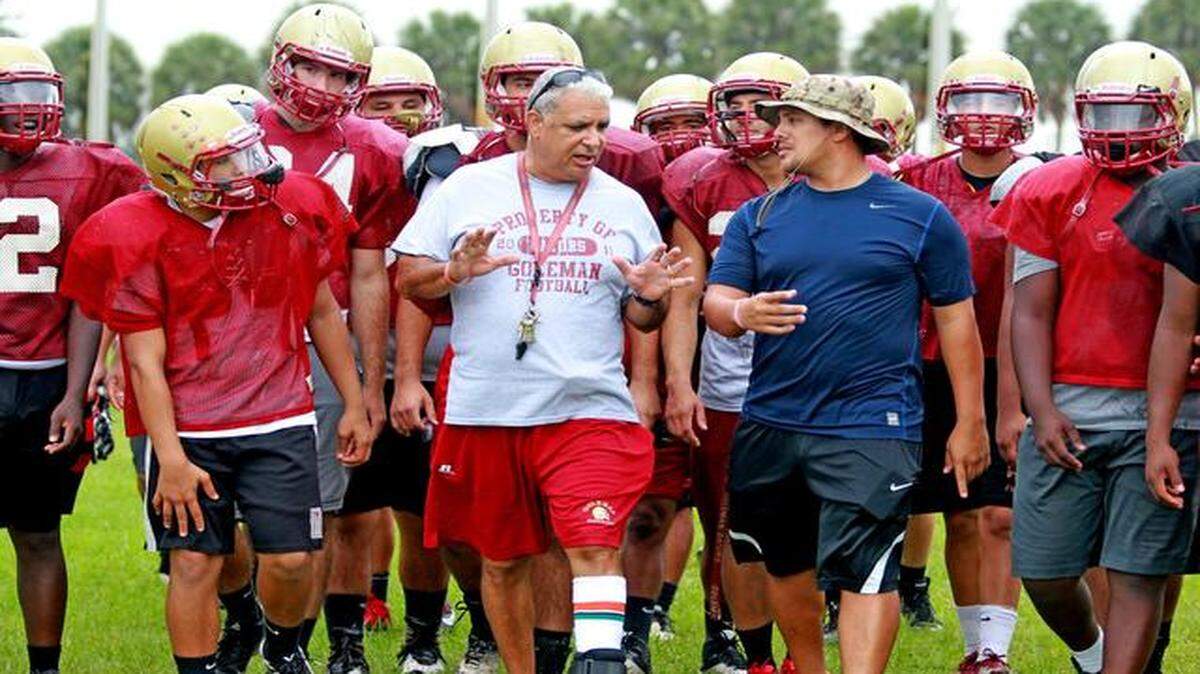 Outshining adversity:  Defensive coordinator John Murillo and son coach Peter Quintanilla.