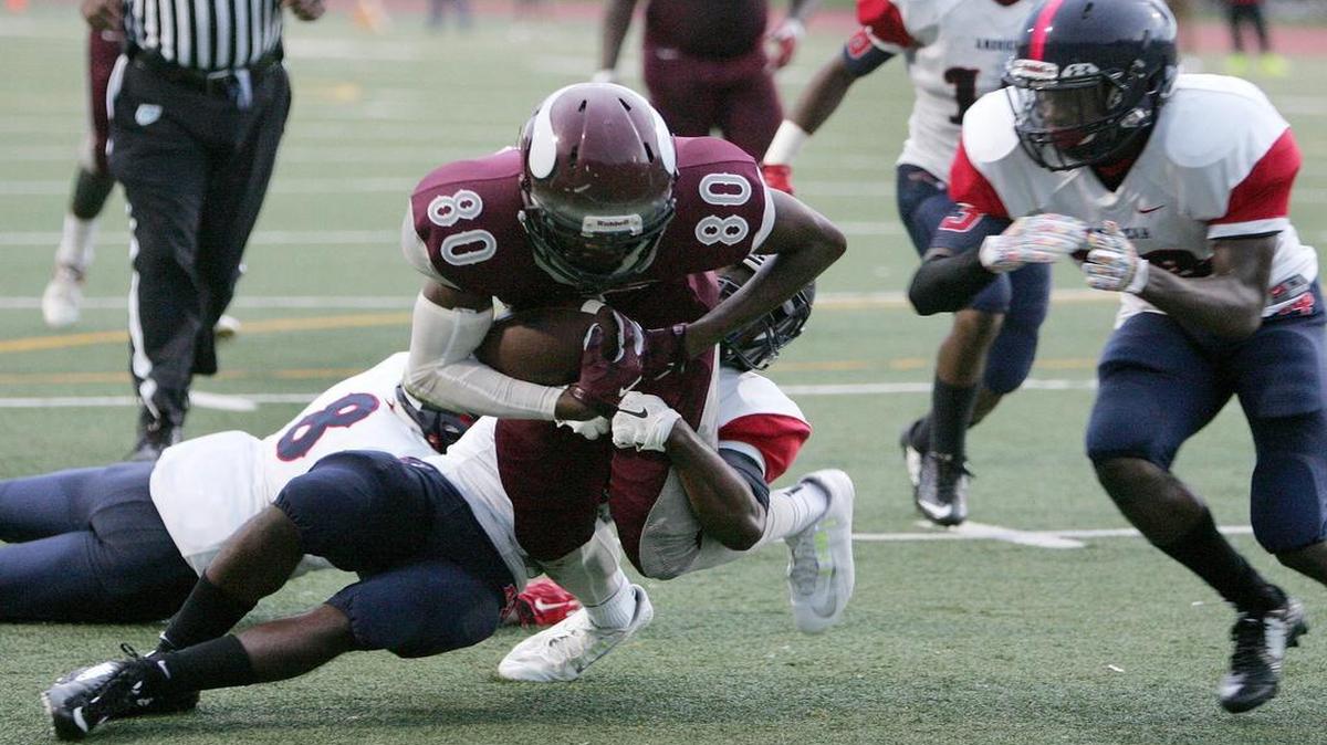 
Norland’s Terrell Scott works his way into the end zone Thursday, helping lead the Vikings to a 31-0 victory over American at North Miami Stadium.
