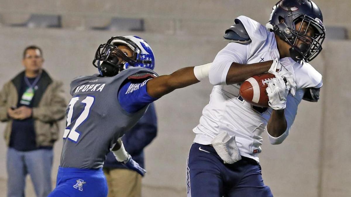 
Piece of the puzzle: Columbus wide receiver Jerron Rollins, right, catches a touchdown pass during the second quarter of last season’s Class 8A title game, which the team lost to Apopka. The Explorers look primed for another chance to win their first title.
