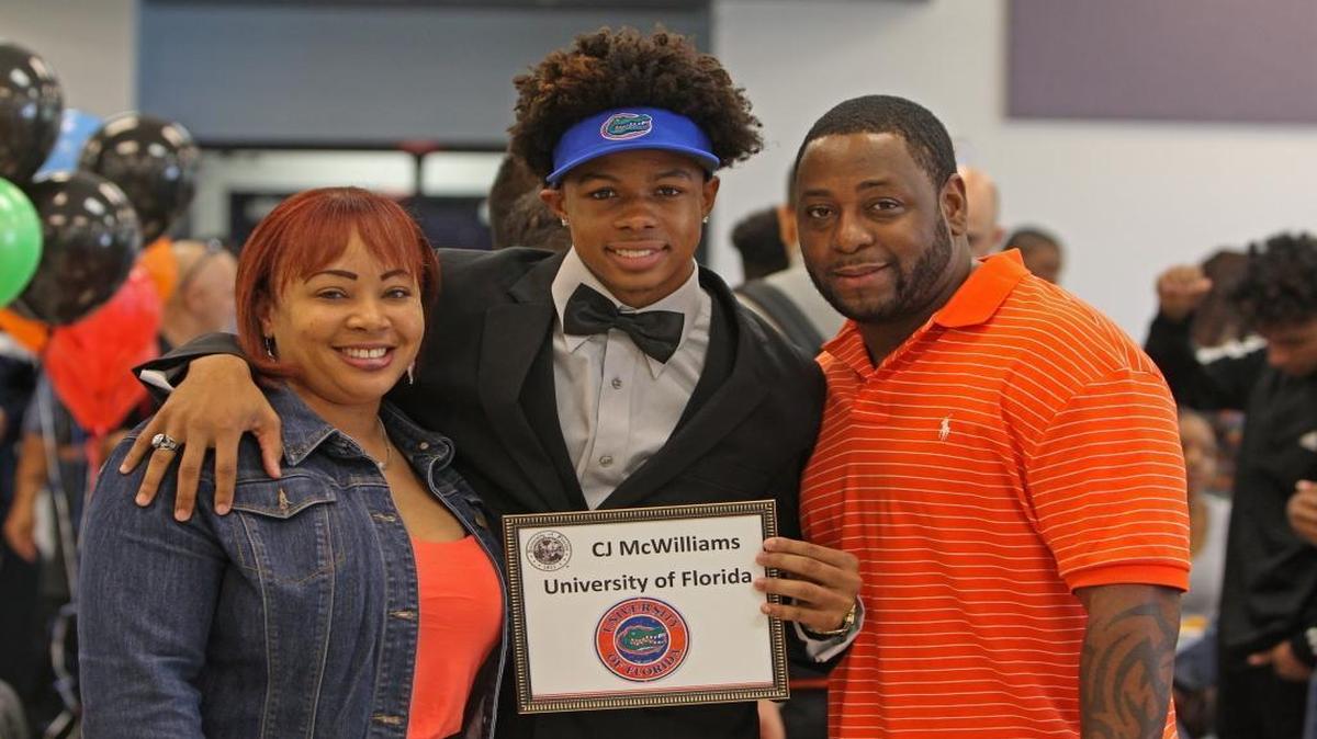Southwest’s Christopher McWilliams, posing with his mother Kimone Fance and stepfather Ell Fance, signed with the University of Florida on National Signing Day on Wednesday Feb., 3, 2016.