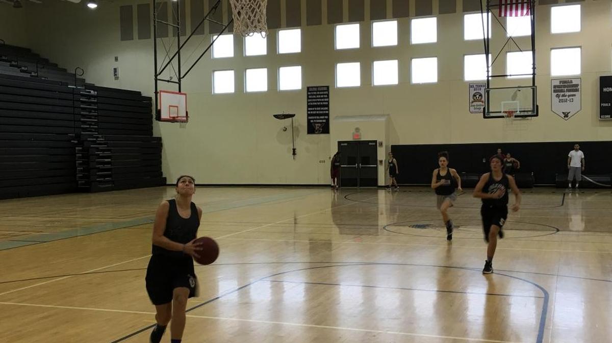 Ferguson guard Natalia Pineda drives to the basket during a practice drill at Ferguson High. The Falcons are playing in the Class 8A state semifinals for the first time Friday.