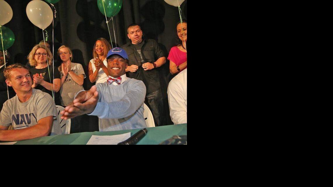 
Westminster Christian running back Jordan Cronkrite makes his decision to go to the University of Florida on Feb. 4, 2015. Westminster Christian soccer player Eli Medder, left, will attend the Naval Academy.

