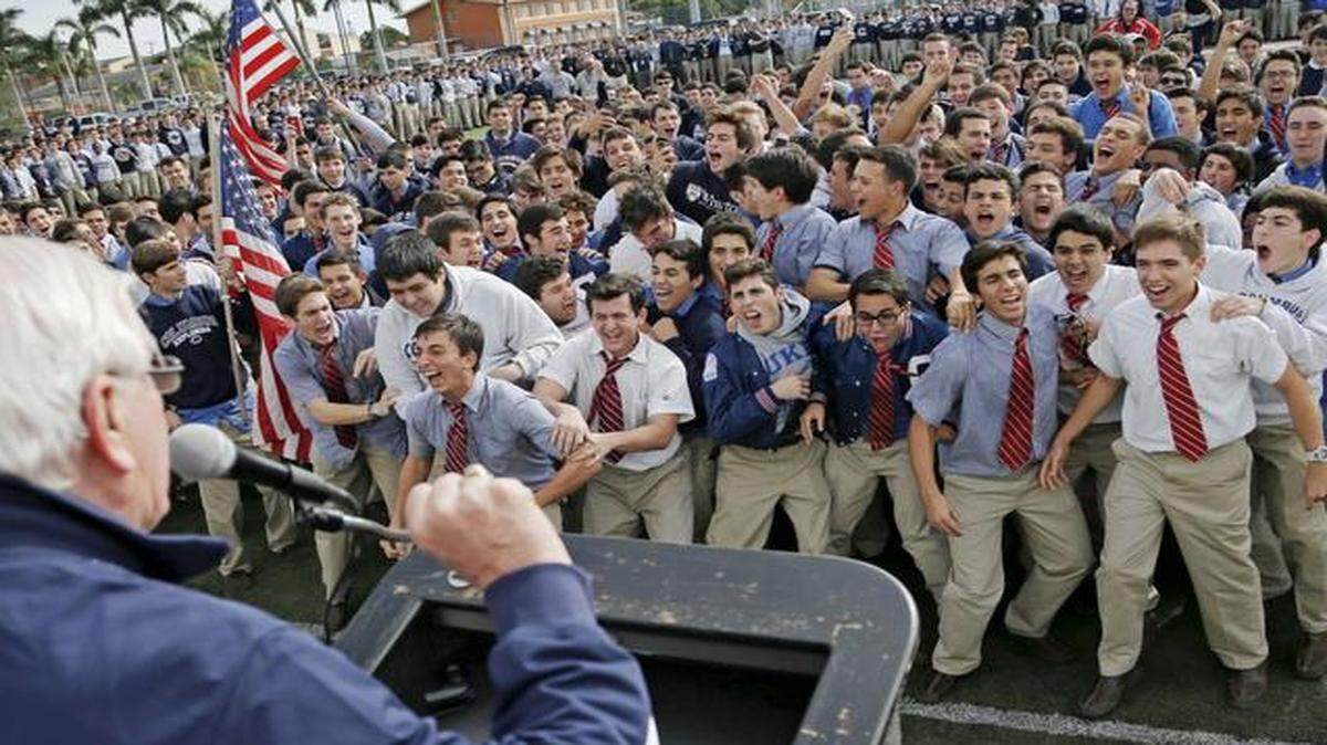
Kevin Handibode, president of Columbus High, leads the cheers during a pep rally for Saturday’s state football final.
