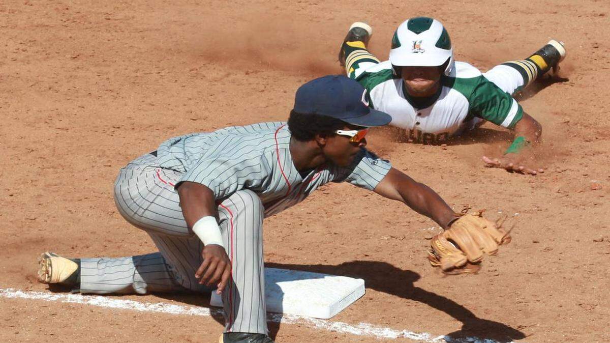 
Columbus’ Jackie Urbaez puts the tag down on Killian’s Daniel Trillo in the GMAC final.


