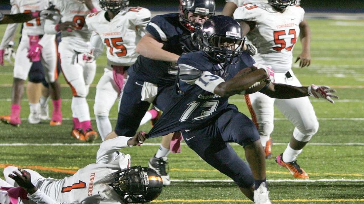 Columbus Explorers Darren Davis Jr. (13) plays against the Booker T. Washington Tornadoes on Friday, October 23, 2015 at Tropical Park Stadium in Miami.
