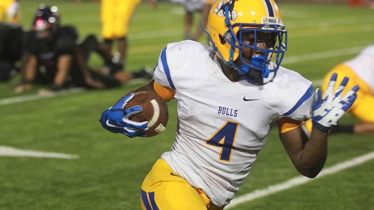 
Corey Lane of Northwestern High runs free against American High at Traz Powell Stadium, Friday, August 28, 2015.

