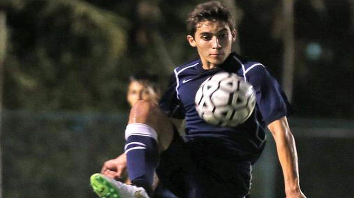 
Columbus’ Charles Polit kicks the ball as they play American in the GMAC Boys' soccer final at Milander Park, Hialeah, Fla, January 15, 2015.
