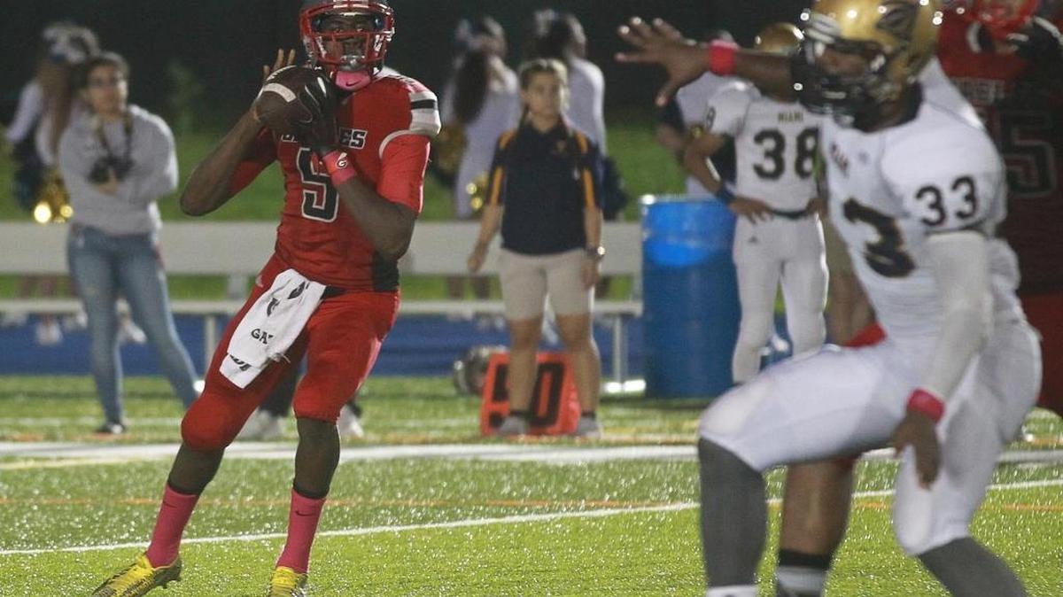 
Coral Gables senior quarterback Voshon Waiters drops back Friday. He threw one touchdown pass and ran for another.
