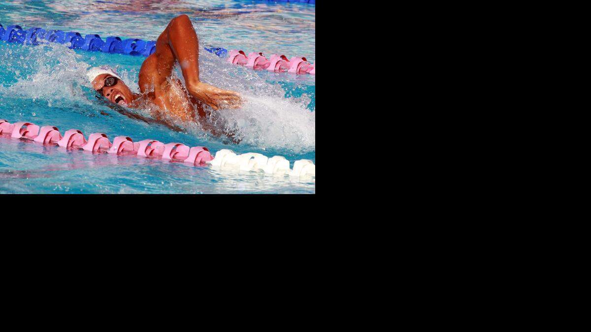
Setting the pace: Che Davis of Krop High wins the boys’ 100 freestyle in 4836 at the Greater Miami Athletic Conference swimming meet on Thursday at the Miami Dade College North campus pool.
